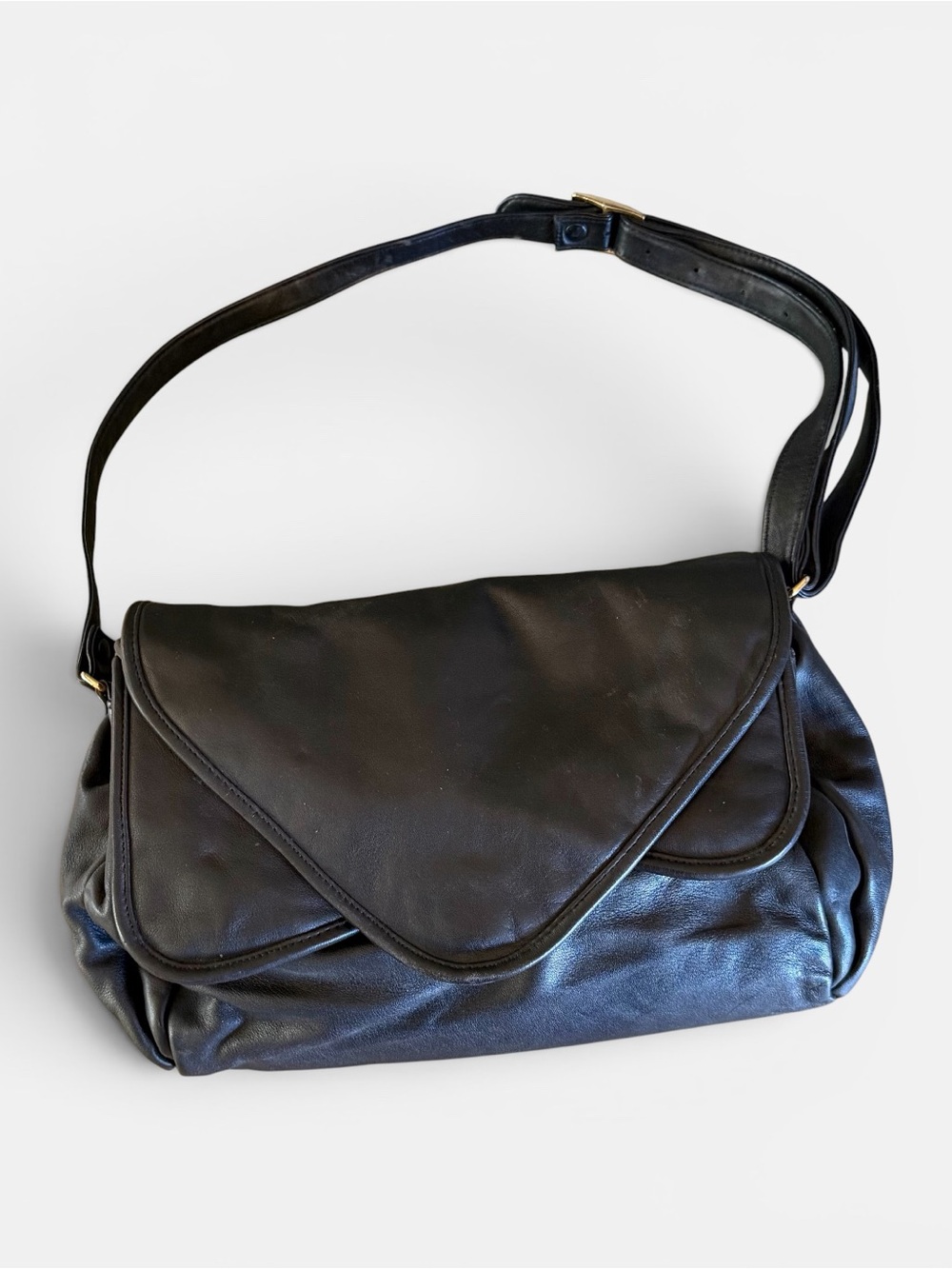 Vintage 80s Brio black leather shoulder bag. Triple flap signature velvet lining